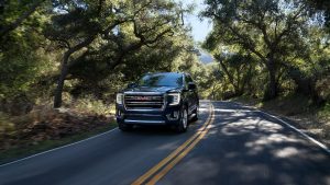 2021 GMC Yukon Driving Down a Road